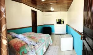 Cama ou camas em um quarto em Pousada Ilha do Mel
