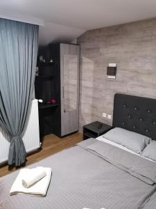 Postel nebo postele na pokoji v ubytování Prenoćište Day Holiday