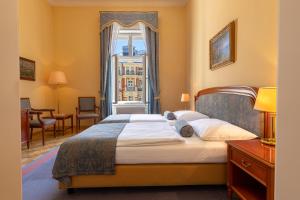 Posteľ alebo postele v izbe v ubytovaní Grandhotel Pupp