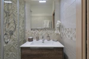 a bathroom with a sink and a shower at Meridiana B&B in Palermo +26 photos