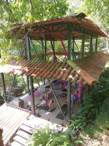 a gazebo with a group of people in it at Funky Monkey Lodge in Santa Teresa Beach