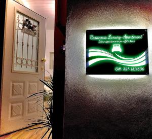 um sinal numa parede ao lado de uma porta em CASANOVA - Luxury Apartment em Vibo Valentia