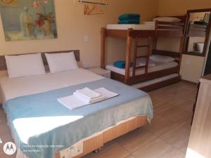 Postel nebo postele na pokoji v ubytování Pousada Recanto Feliz