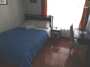 Postel nebo postele na pokoji v ubytování Casa Irazú