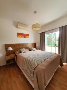 Posteľ alebo postele v izbe v ubytovaní Arena de Mar Dpto B