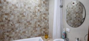 a bathroom with a sink and a mirror at Cabaña Rodamonte - Neusa in Cogua