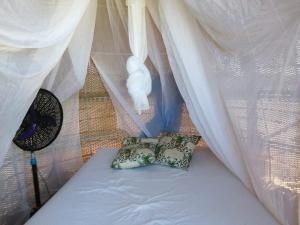 Voodi või voodid majutusasutuse Glamping UVA Playa toas