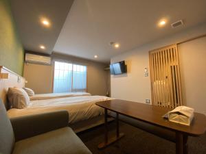 Rúm í herbergi á HIZ HOTEL Gion-Shirakawa