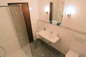 Phòng tắm tại Hotel Berghof