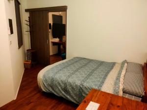 Voodi või voodid majutusasutuse Formosa Backpackers Hostel & Apartment（青年民宿） toas