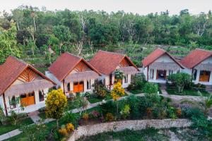 an aerial view of a house with red roof at Camar Cottage & Hostel in Nusa Penida