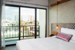 เตียงในห้องที่ Himku Hotel - adult only