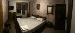 Letto o letti in una camera di Yulita