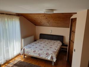 Postel nebo postele na pokoji v ubytování Lidia House
