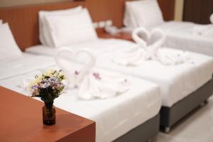 Postel nebo postele na pokoji v ubytování Rest@Ratchada hotel