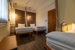 Postel nebo postele na pokoji v ubytování Cozy House Hostel