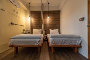 Postel nebo postele na pokoji v ubytování Cozy House Hostel