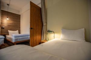 Postel nebo postele na pokoji v ubytování Cozy House Hostel