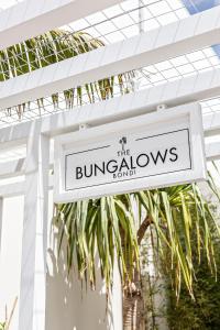 a sign for the burjollahs hotel at The Bungalows at Bondi in Sydney