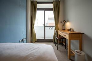 Postel nebo postele na pokoji v ubytování Cozy House Hostel