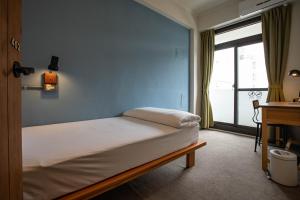 Postel nebo postele na pokoji v ubytování Cozy House Hostel