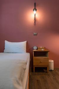 Ένα ή περισσότερα κρεβάτια σε δωμάτιο στο Cozy House Hostel