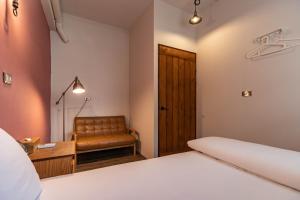 Postel nebo postele na pokoji v ubytování Cozy House Hostel