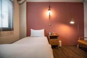 Postel nebo postele na pokoji v ubytování Cozy House Hostel