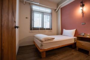 Postel nebo postele na pokoji v ubytování Cozy House Hostel