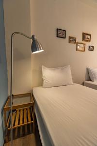 Postel nebo postele na pokoji v ubytování Cozy House Hostel
