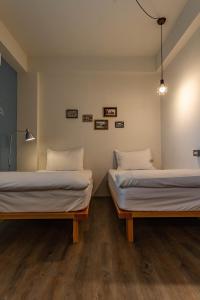Postel nebo postele na pokoji v ubytování Cozy House Hostel