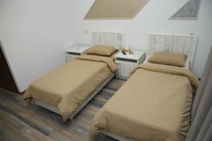 Postel nebo postele na pokoji v ubytování Hotel Gold