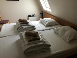 Кровать или кровати в номере Appartement Ut & Thus, Resort Amelander Kaap