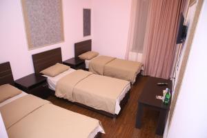 Postel nebo postele na pokoji v ubytování Hotel Gold