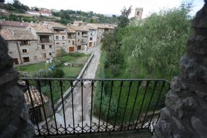 a view of a town from a stone wall at Cal Ferrer Nou in Alpens