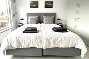 Ένα ή περισσότερα κρεβάτια σε δωμάτιο στο Alibi aan Zee