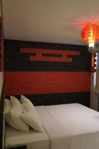 Postel nebo postele na pokoji v ubytování Pak Suítes Hotel