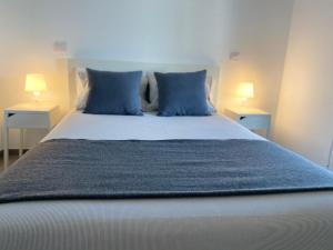 Un pat sau paturi într-o cameră la Apartamento Martina