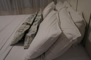 Postel nebo postele na pokoji v ubytování Pak Suítes Hotel