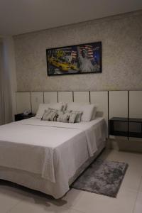 Postel nebo postele na pokoji v ubytování Pak Suítes Hotel
