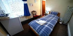 Postel nebo postele na pokoji v ubytování Lynmoore Guest House