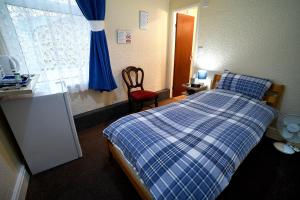 Postel nebo postele na pokoji v ubytování Lynmoore Guest House