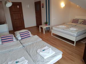 Postel nebo postele na pokoji v ubytování Balaton Rowy