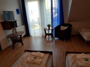 Postel nebo postele na pokoji v ubytování Balaton Rowy