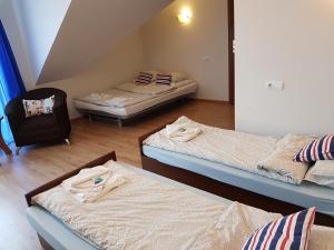 Postel nebo postele na pokoji v ubytování Balaton Rowy
