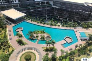 an overhead view of a large swimming pool with a building at United Point Residence By Sleepy Bear in Kuala Lumpur