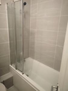 a shower with a glass door in a bathroom at Wherstead Road House in Ipswich