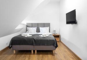 Posteľ alebo postele v izbe v ubytovaní Apartamenty, Boutique Rooms Villa 82, MIEJSCE PRKINGOWE