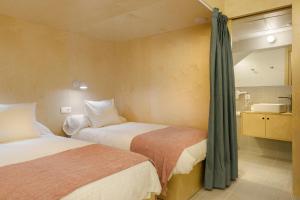 A bed or beds in a room at Loft Casa Berdón