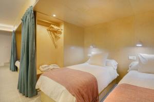 A bed or beds in a room at Loft Casa Berdón